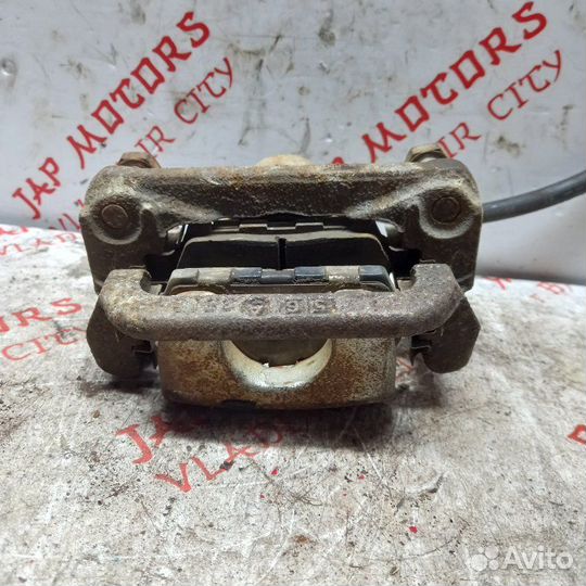 Суппорт тормозной задний левый Nissan X Trail T30