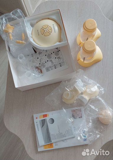 Молокоотсос Medela Swing Maxi + смартсоска Calma