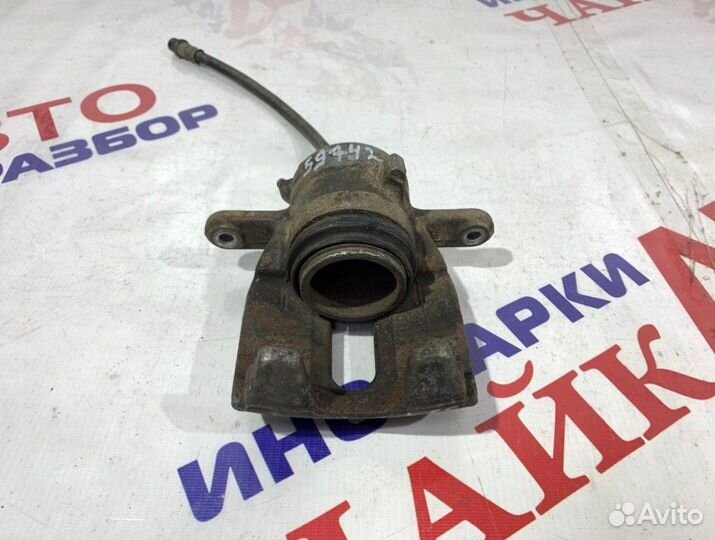 Суппорт тормозной передний левый Nissan Almera G15