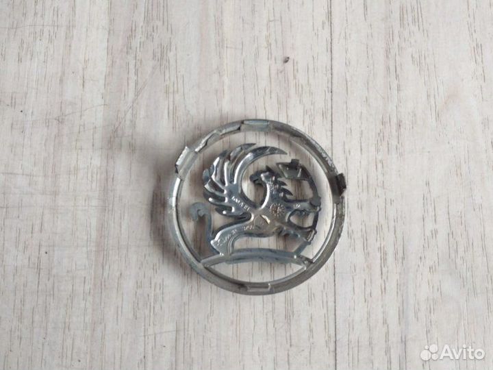 Эмблема в решетку радиатора передняя Opel Astra H