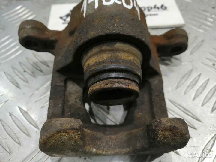 Суппорт тормозной задний левый Nissan Teana J31