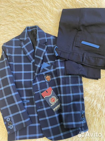 Костюм для мальчика новый 122-7лет