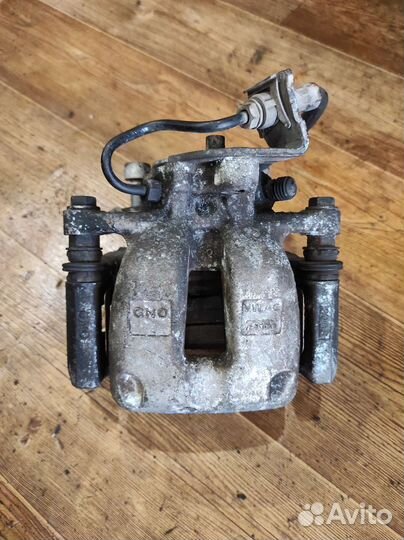 Суппорт задний левый VW Passat B6 12 шлицов