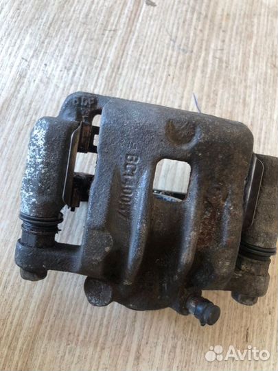 Суппорт тормозной задний левый Ssangyong Actyon