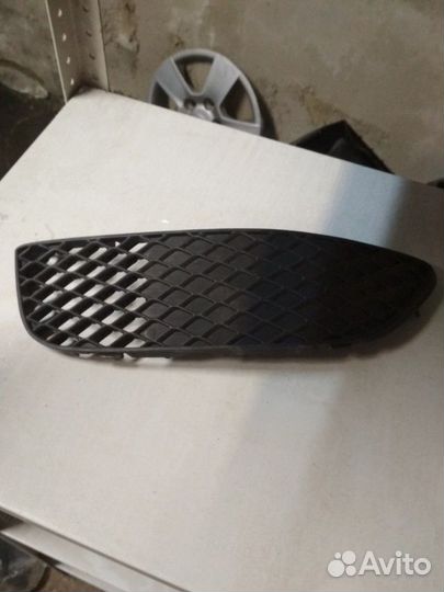 Решетка левая туманки Мицубиши Лансер 10