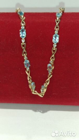 Золотой браслет с топазами