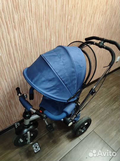 Трехколесный велосипед-коляска с ручкой