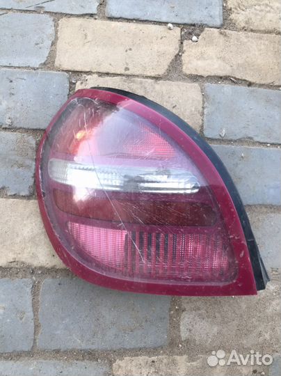 Задний левый фонарь Ниссан Альмера н16 хэтчбек