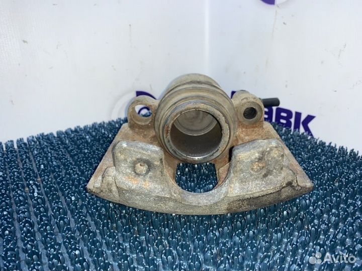 Суппорт Mazda Demio