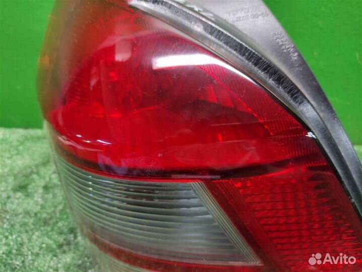 Фонарь задний наружный левый Toyota Yaris P90 2010