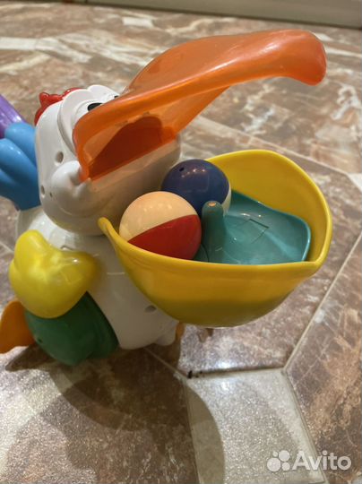 Игрушка каталка с ручкой Пеликан