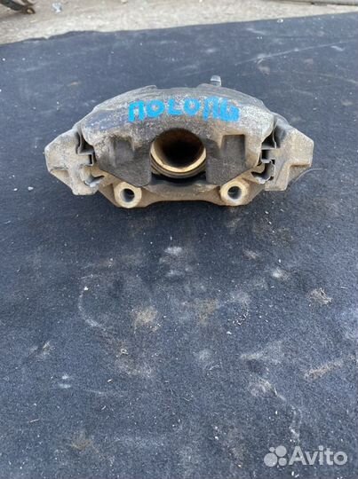 Суппорт тормозной передний левый VW Polo