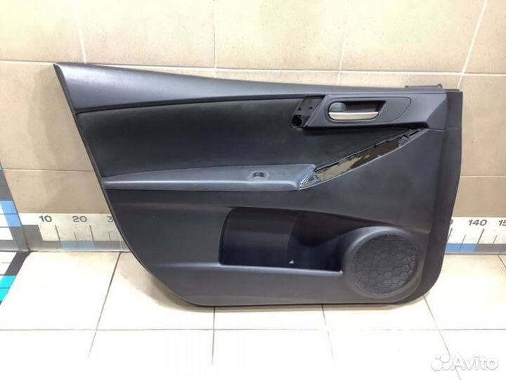 Обшивка двери передней левой передняя левая Mazda