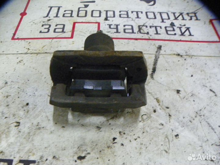 Суппорт тормозной задний левый Mazda CX-7