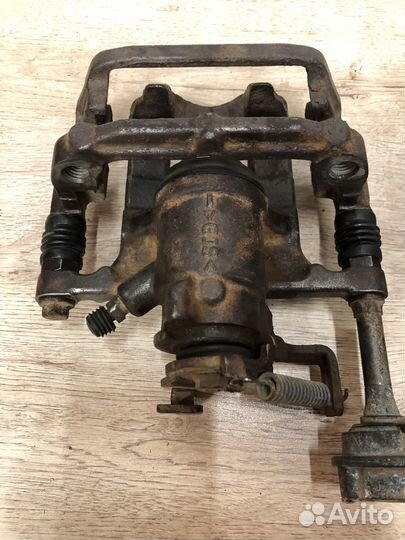 Суппорт задний Opel Astra j эл ручник