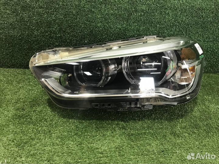 Фара левая BMW X1