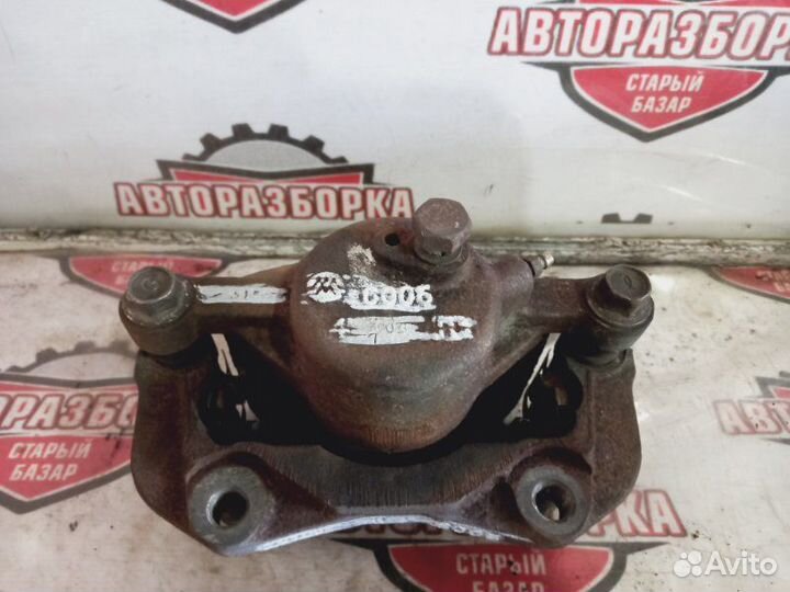 Суппорт тормозной передний левый Isuzu Mu UES25EW