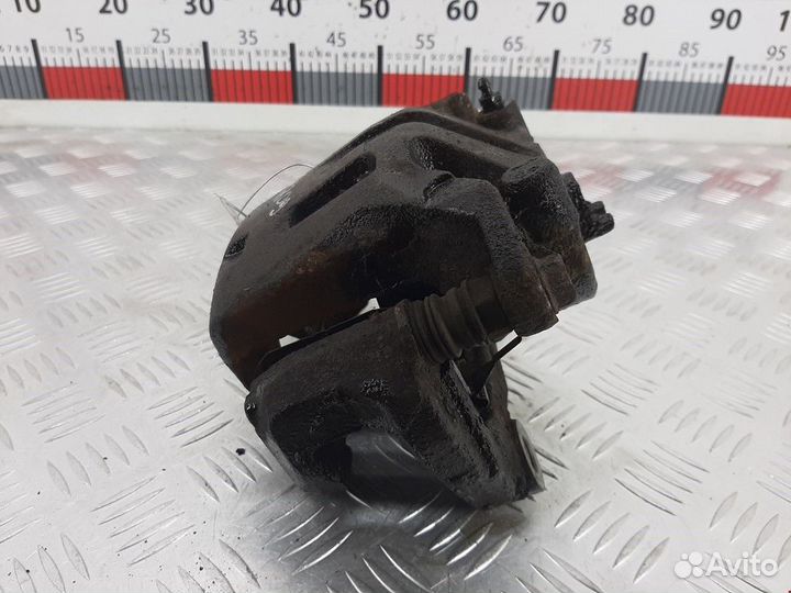 Суппорт передний левый Nissan Navara D22 рест