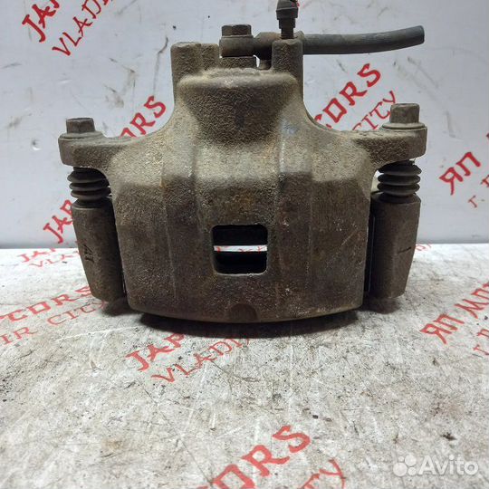 Суппорт тормозной передний левый Mitsubishi Lancer