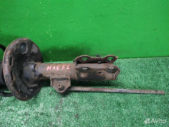 Стойка амортизатора передняя левая Toyota Auris E