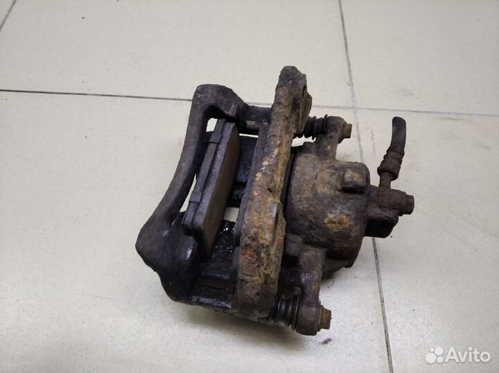 Суппорт передний левый Almera N16 2000-2006