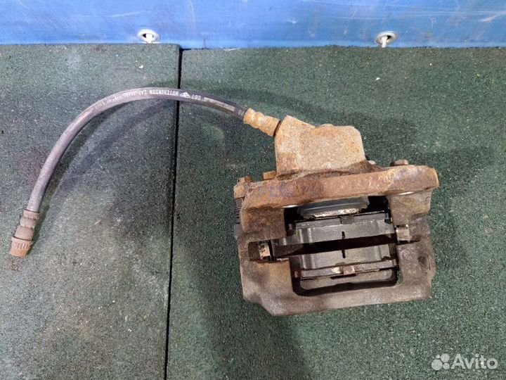 Суппорт тормозной передний левый Renault Logan 1