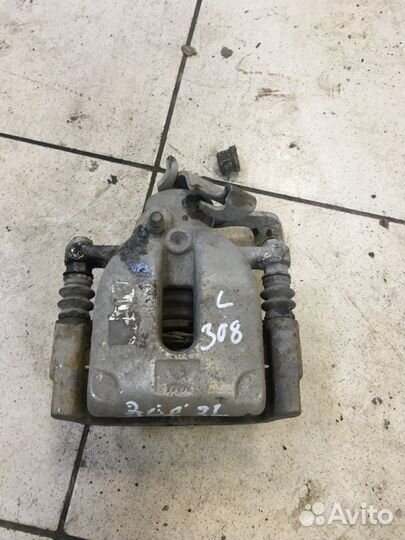 Суппорт тормозной задний левый Peugeot 308