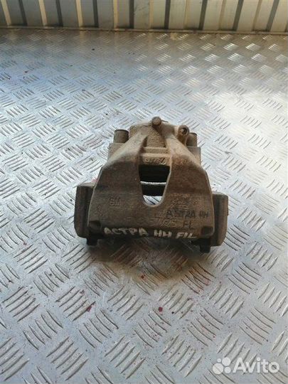 Суппорт тормозной передний левый Opel Astra H L48