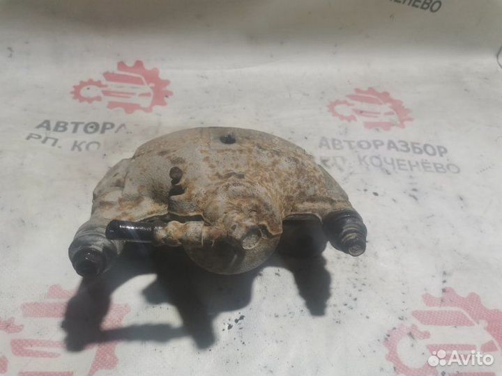 Суппорт тормозной передний левый Toyota Corolla