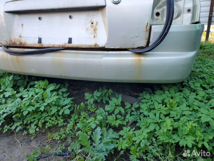 Бампер задний мазда Demio