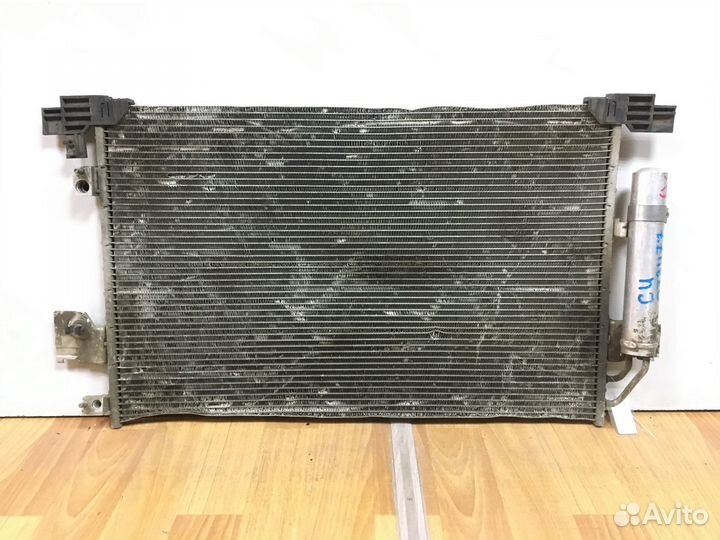 Радиатор кондиционера (конденсер) Mitsubishi Outla