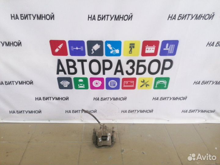 Суппорт тормозной задний левый Nissan Tiida C11