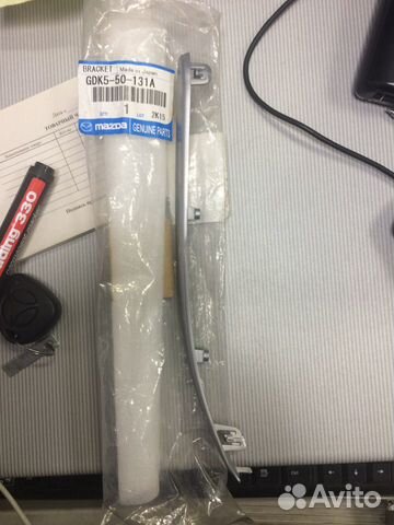 Кронштейн противотуманной фары левый mazda