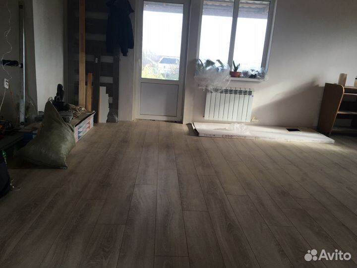 Укладка ламината и монтаж плинтуса