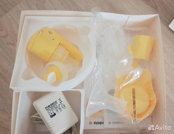 Электрический молокоотсос medela