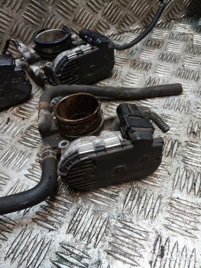 Заслонка дроссельная электрическая Opel Corsa D