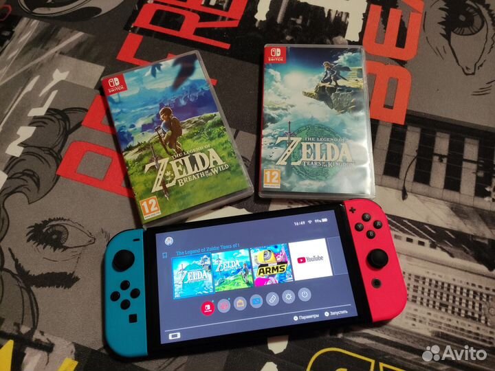 Nintendo Switch Oled 64 GB с двумя играми и чехлом