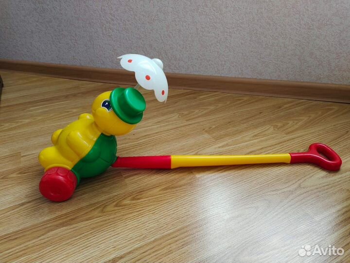 Игрушка каталка с ручкой