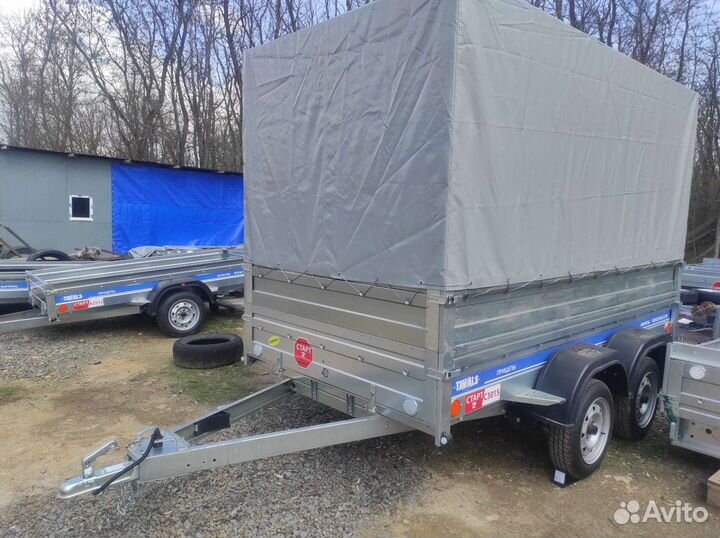 Двухосный прицеп с бортами и тентом