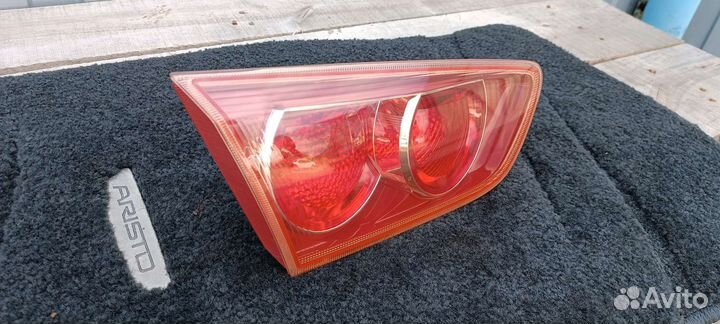 Фонарь левый в крышку багажника Лансер 10 седан