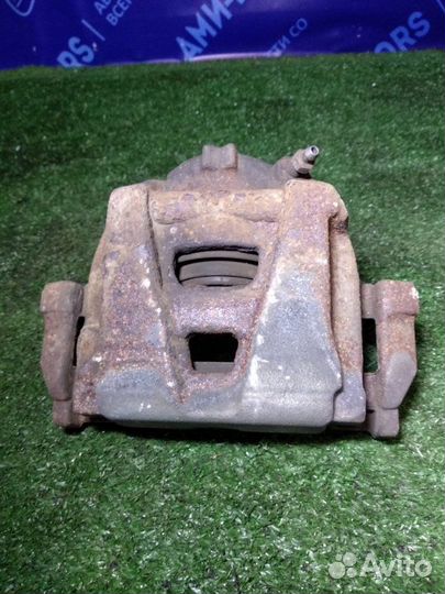 Суппорт тормозной передний левый Volkswagen Tiguan