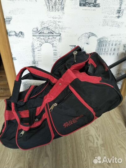 Сумка дорожная на колесах с выдвижной ручкой