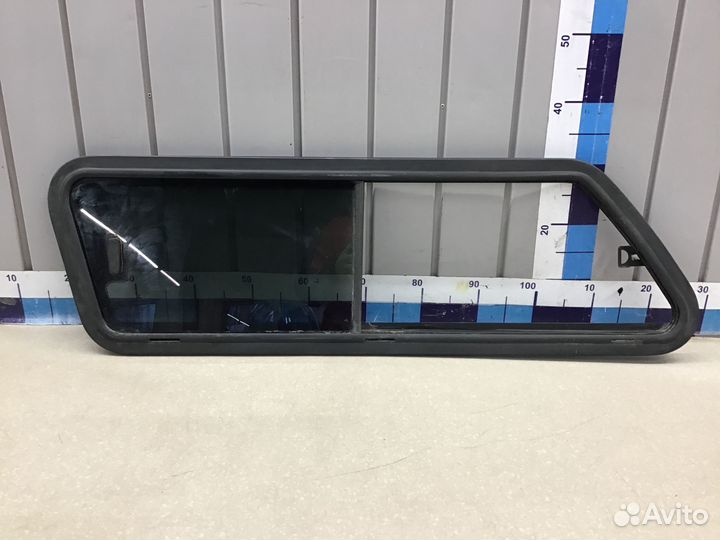 Стекло кузовное глухое левое Mitsubishi L200 (KB)