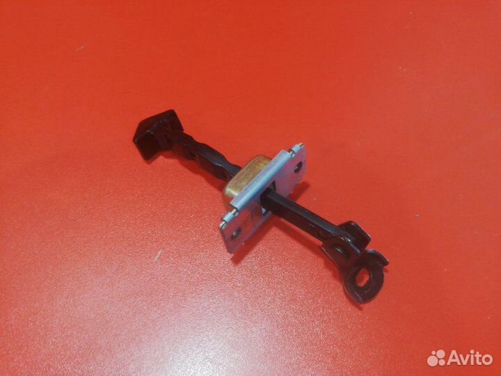 Ограничитель двери передний Mazda Verisa DC5W