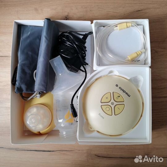 Молокоотсос medela электрический