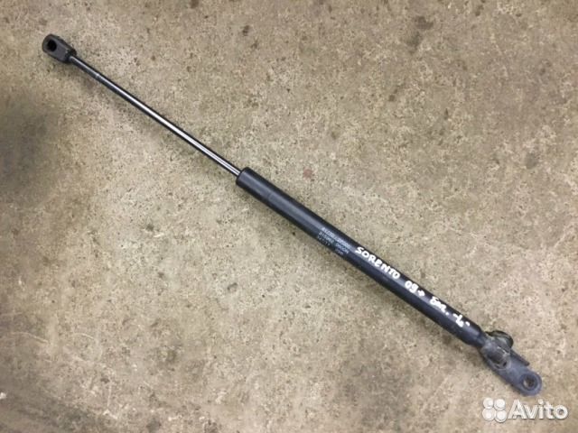 Амортизатор двери багажника Киа Соренто после 2009