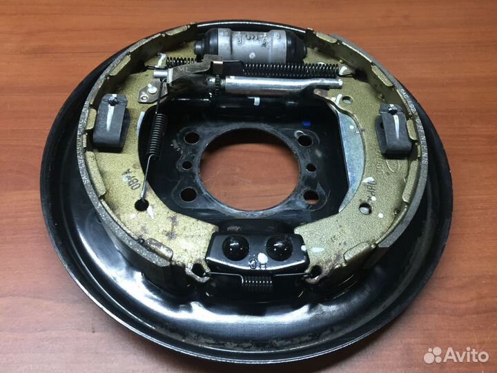 Щит опорный задний левый KIA RIO 58300-H5200