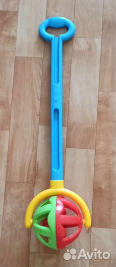 Игрушка каталка с ручкой