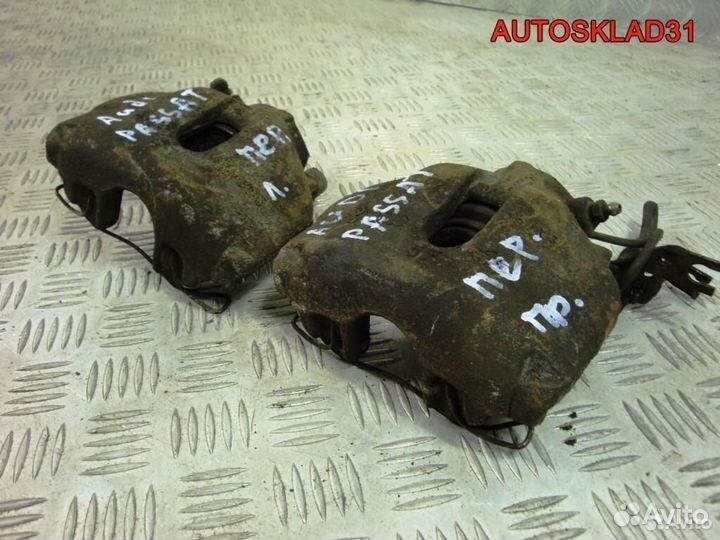 Суппорт тормозной передний VW Passat B5