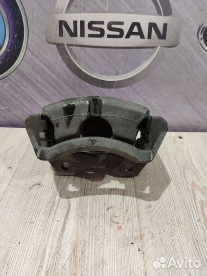 Суппорт тормозной перед Nissan primera P12 Лев